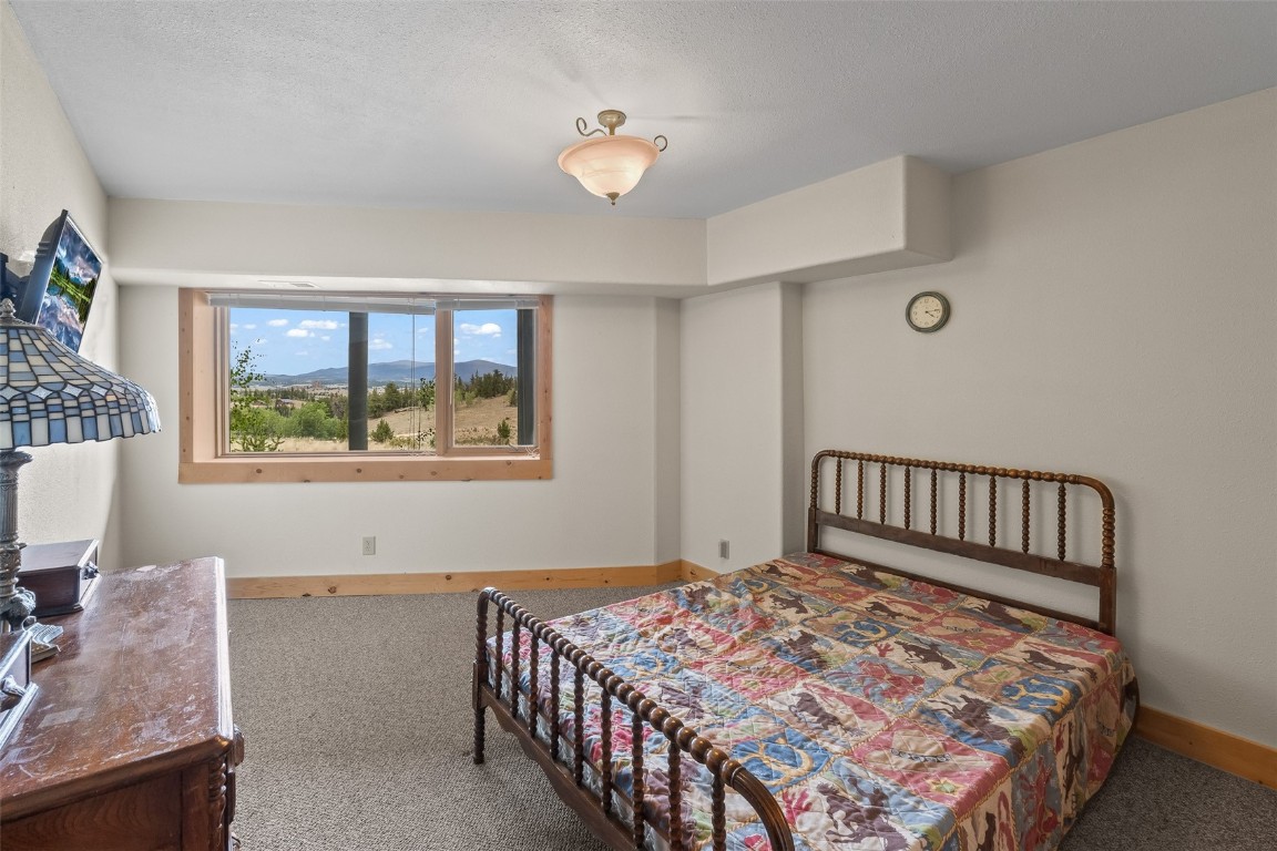 486-432 Turk Pony Way Como, CO 80456 - Photo 28 of 49 a bedroom with a bed and a window