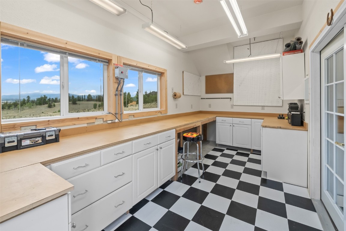 486-432 Turk Pony Way Como, CO 80456 - Photo 36 of 49 a kitchen with a sink a stove a refrigerator and cabinets