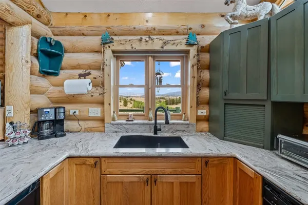 a kitchen with a sink and a refrigerator