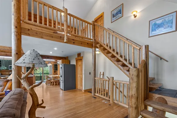 a view of a livingroom with furniture and stairs