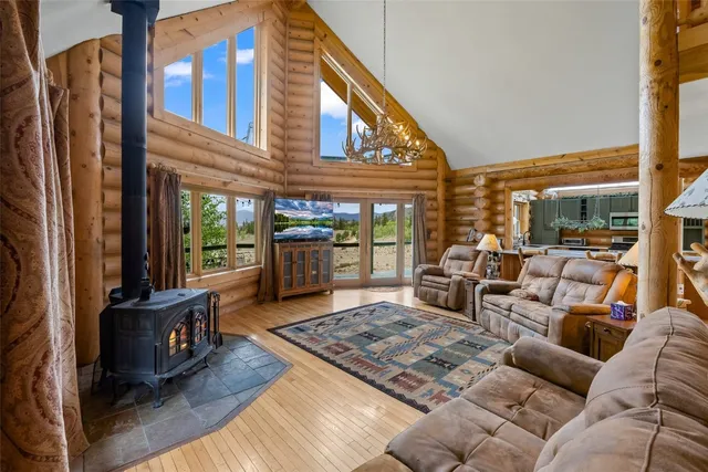 a living room with furniture rug and a table