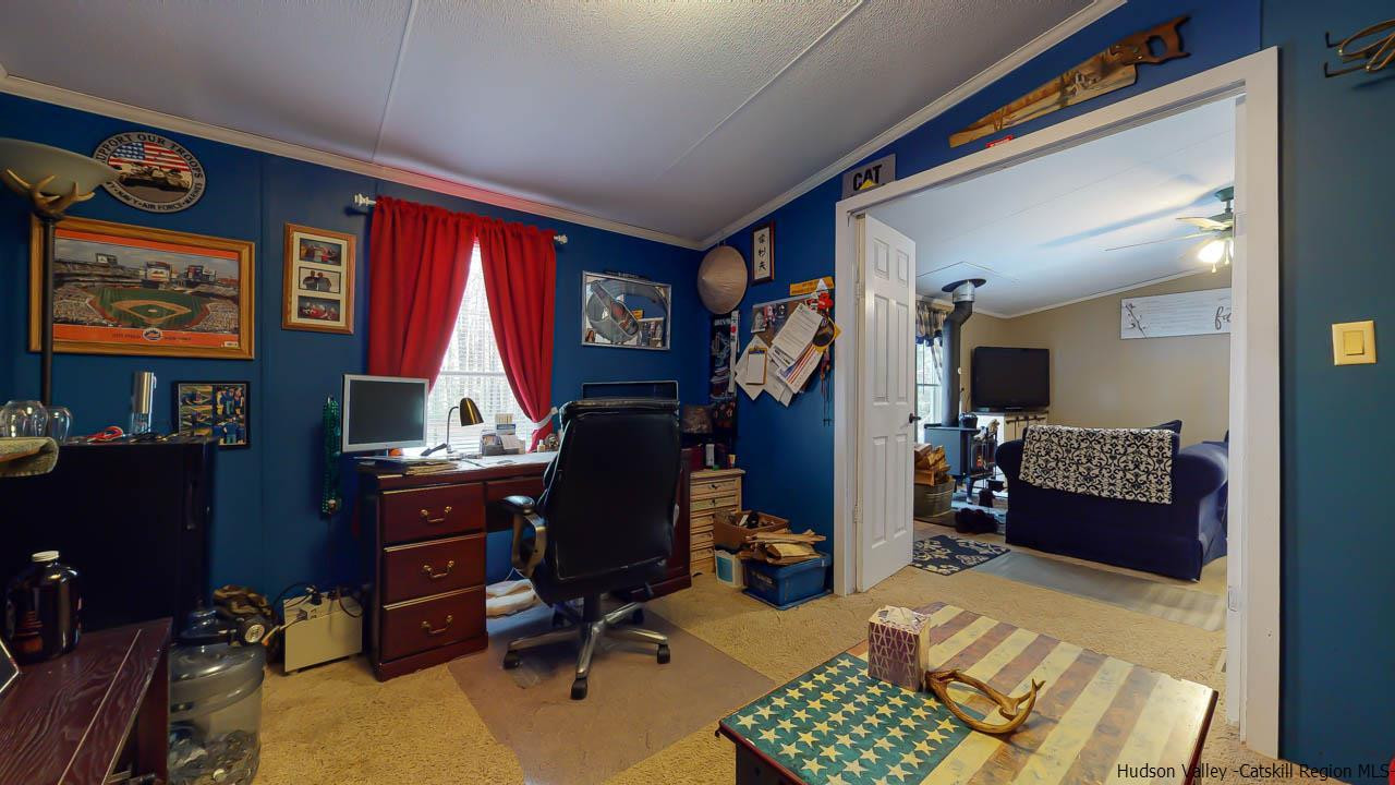 271 Scarawan Road Stone Ridge, NY 12484 - Photo 14 of 27 a view of a workspace with furniture and a window