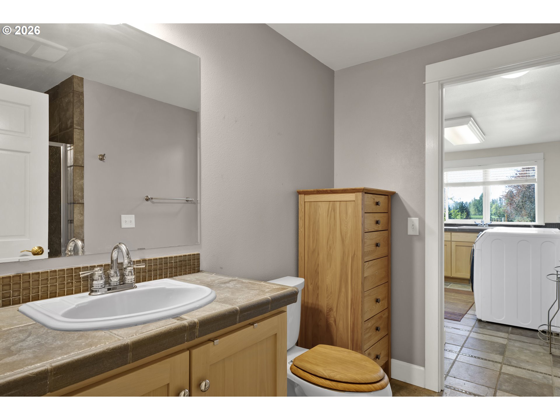 7924 Thurston Road Springfield, OR 97478 - Photo 25 of 45 a bathroom with a sink a toilet and a mirror