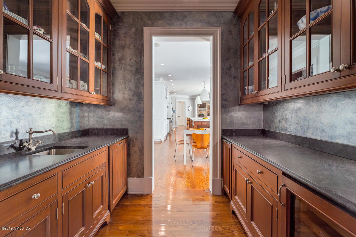 170 Old Mill Road Greenwich, CT 06831 - Photo 13 of 42 a kitchen with stainless steel appliances granite countertop a sink and cabinets