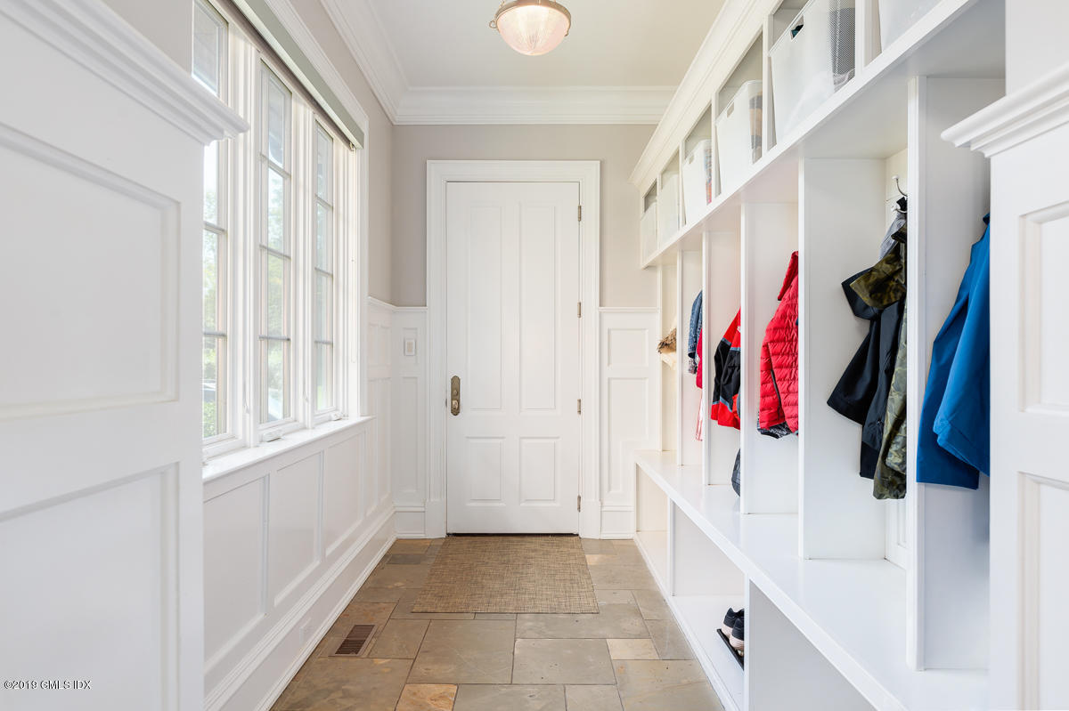 170 Old Mill Road Greenwich, CT 06831 - Photo 20 of 42 a view of a hallway with a white walls and stairs