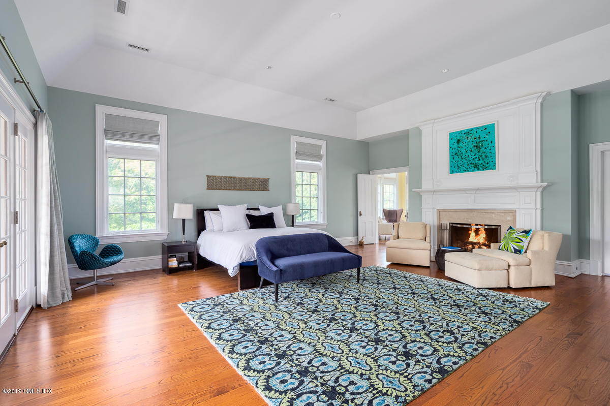 170 Old Mill Road Greenwich, CT 06831 - Photo 21 of 42 a bedroom with a large bed and a couch
