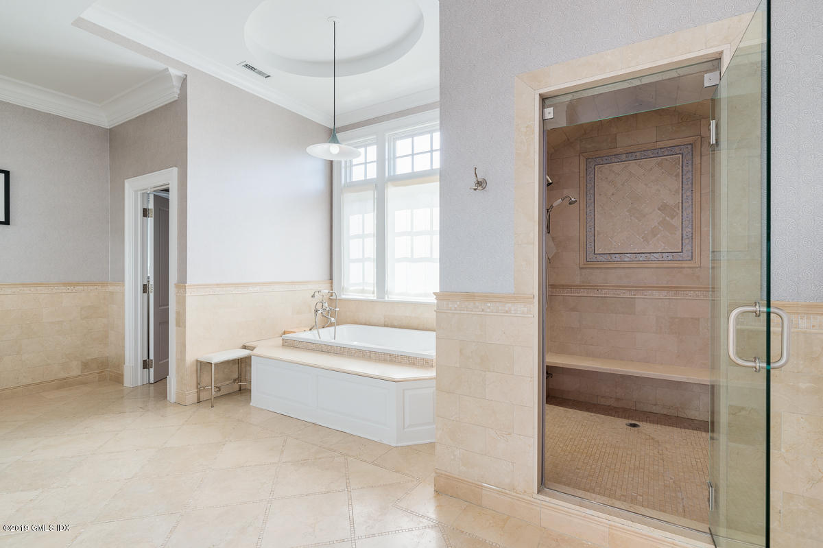 170 Old Mill Road Greenwich, CT 06831 - Photo 23 of 42 a spacious bathroom with a bathtub and a shower