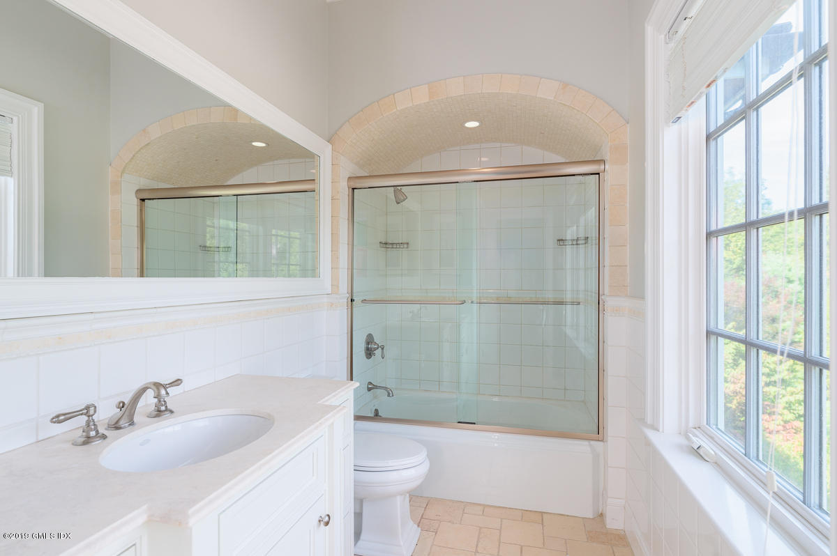 170 Old Mill Road Greenwich, CT 06831 - Photo 28 of 42 a bathroom with a sink a toilet and shower