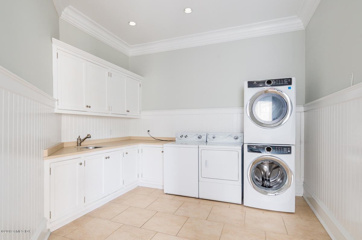 170 Old Mill Road Greenwich, CT 06831 - Photo 31 of 42 a utility room with sink dryer and washer