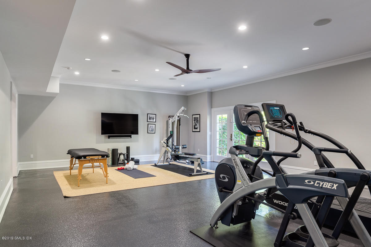 170 Old Mill Road Greenwich, CT 06831 - Photo 32 of 42 a living room with furniture and a flat screen tv