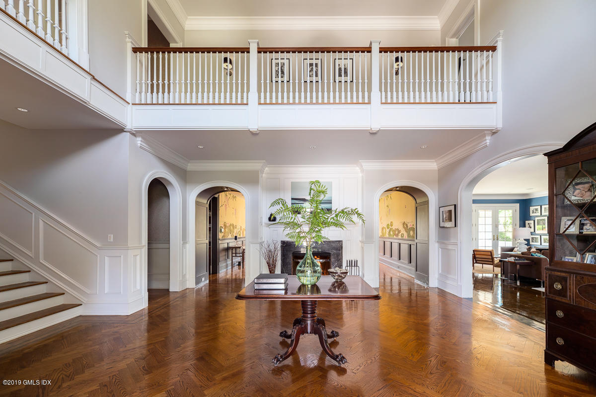 170 Old Mill Road Greenwich, CT 06831 - Photo 5 of 42 a living room with fireplace furniture and a wooden floor