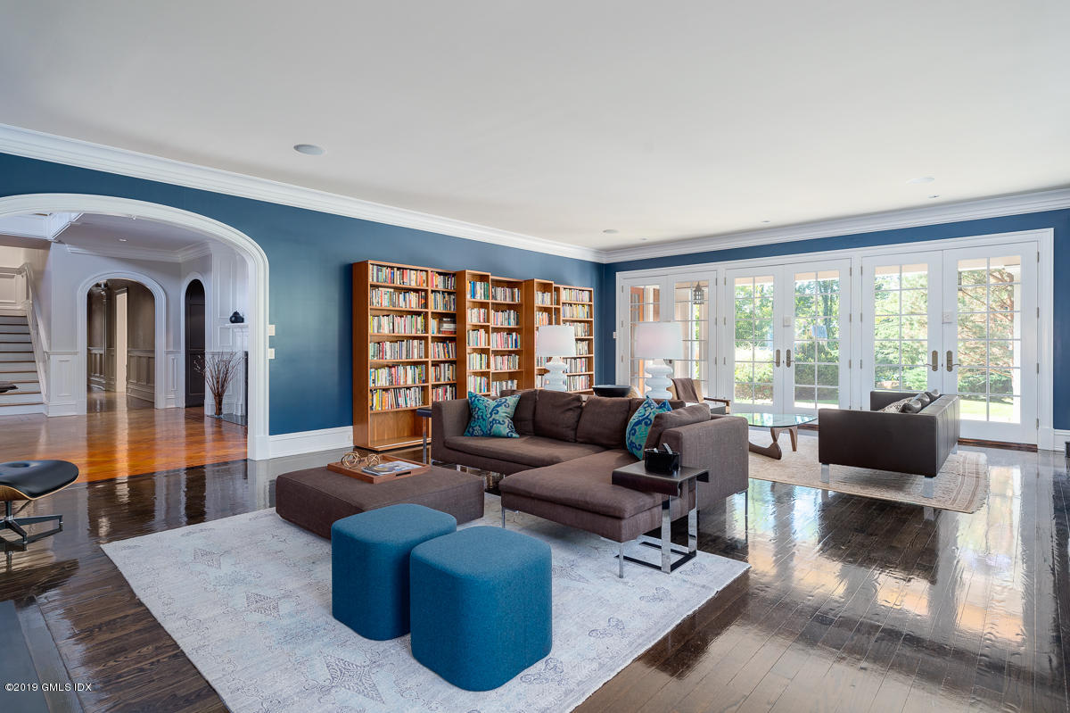 170 Old Mill Road Greenwich, CT 06831 - Photo 9 of 42 a living room with furniture and a floor to ceiling window