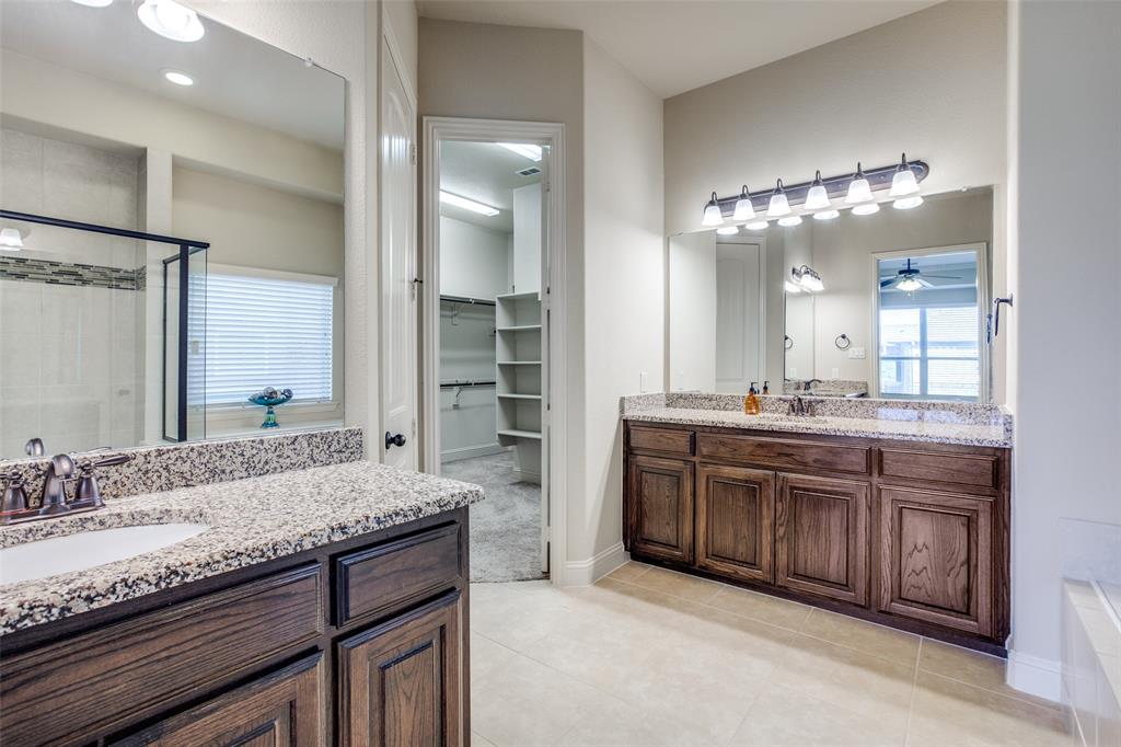 503 Hemlock Court Wylie, TX 75098 - Photo 14 of 35 a bathroom with a granite countertop double vanity sink and a mirror