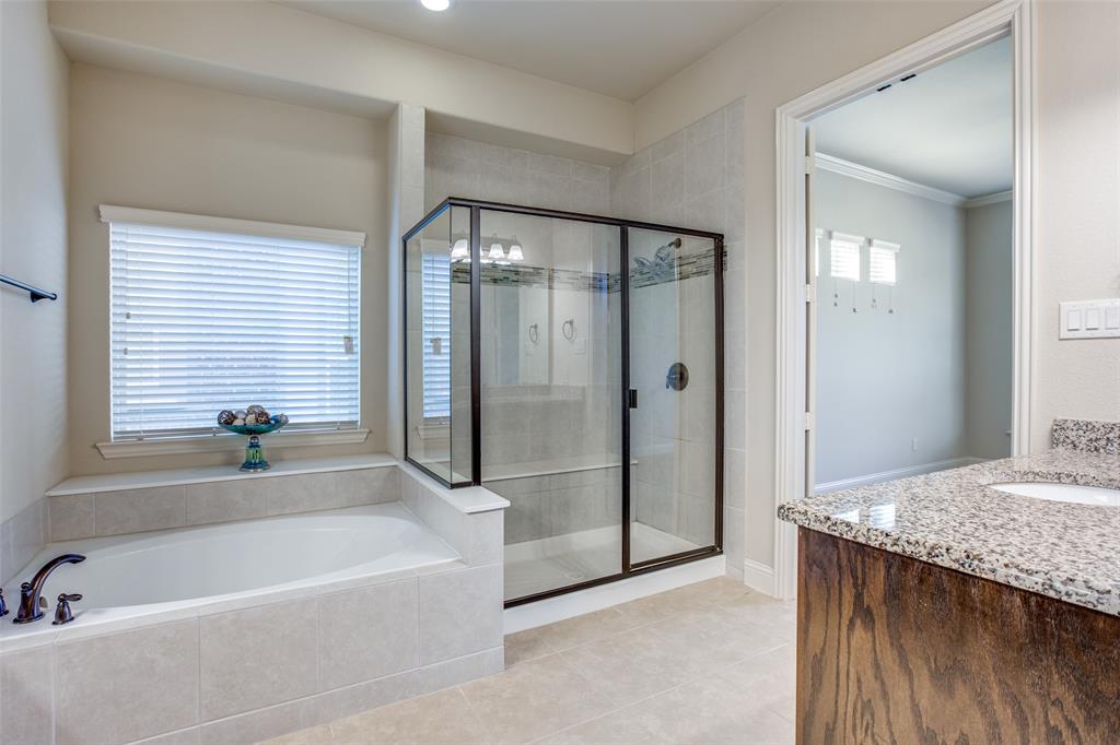 503 Hemlock Court Wylie, TX 75098 - Photo 15 of 35 a bathroom with a granite countertop tub shower and sink