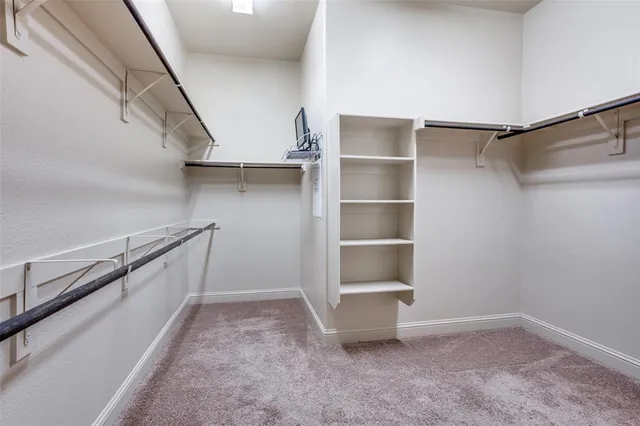 a view of an empty walk in closet