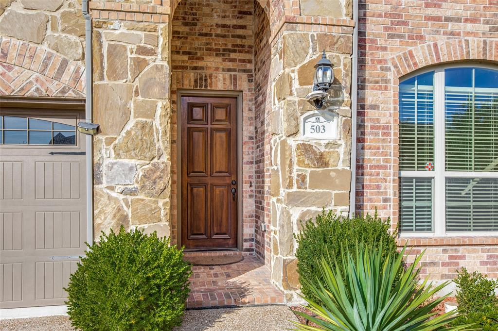 503 Hemlock Court Wylie, TX 75098 - Photo 2 of 35 a view of a brick buildings with many windows