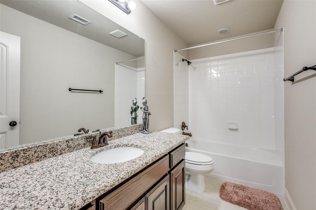 503 Hemlock Court Wylie, TX 75098 - Photo 21 of 35 a bathroom with a granite countertop sink toilet and shower