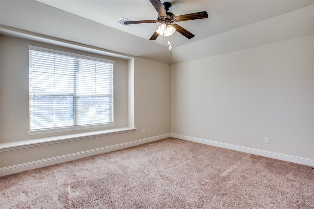 503 Hemlock Court Wylie, TX 75098 - Photo 22 of 35 a view of a livingroom with a ceiling fan and window