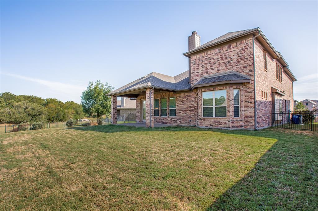 503 Hemlock Court Wylie, TX 75098 - Photo 31 of 35 a front view of a house with a yard
