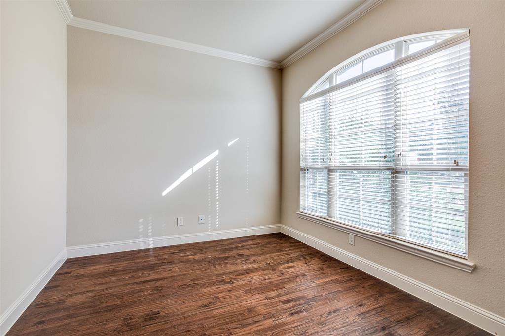 503 Hemlock Court Wylie, TX 75098 - Photo 4 of 35 a view of an empty room with wooden floor and a window