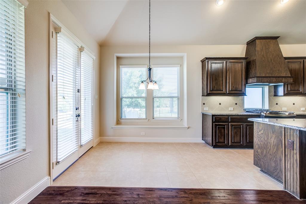 503 Hemlock Court Wylie, TX 75098 - Photo 10 of 35 a living room with stainless steel appliances granite countertop a stove top oven a sink and a refrigerator