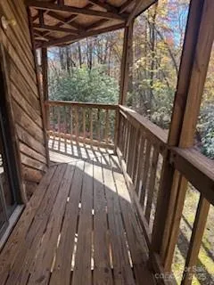 a view of balcony with wooden floor