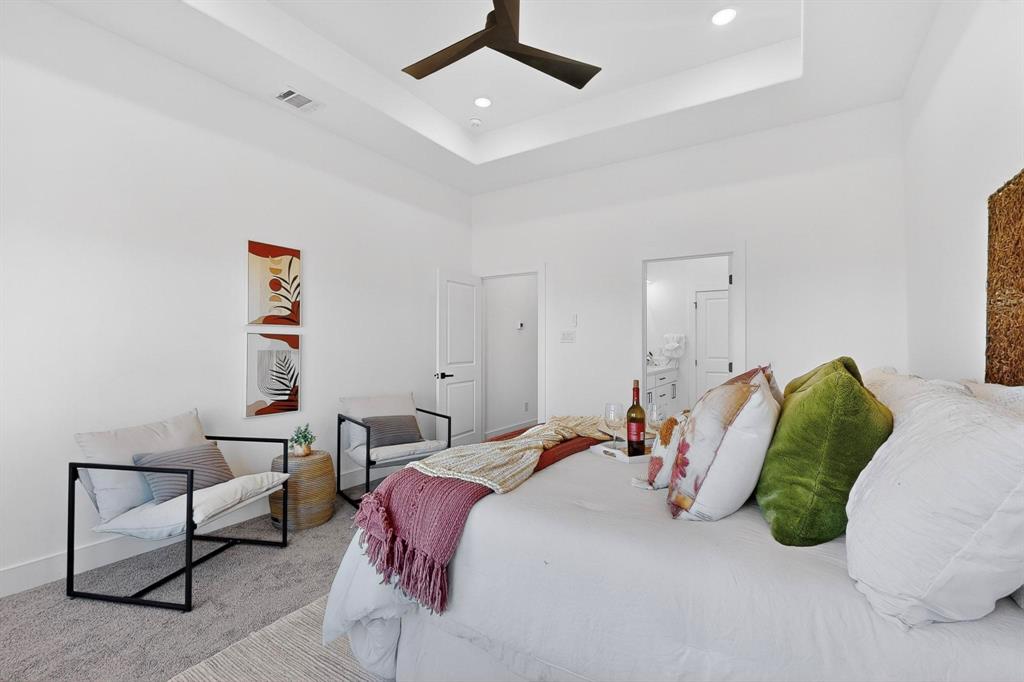 4464 Key Ranch Road Trinidad, TX 75163 - Photo 19 of 40 Bedroom with a tray ceiling, a towering ceiling, a ceiling fan, carpet, and recessed lighting