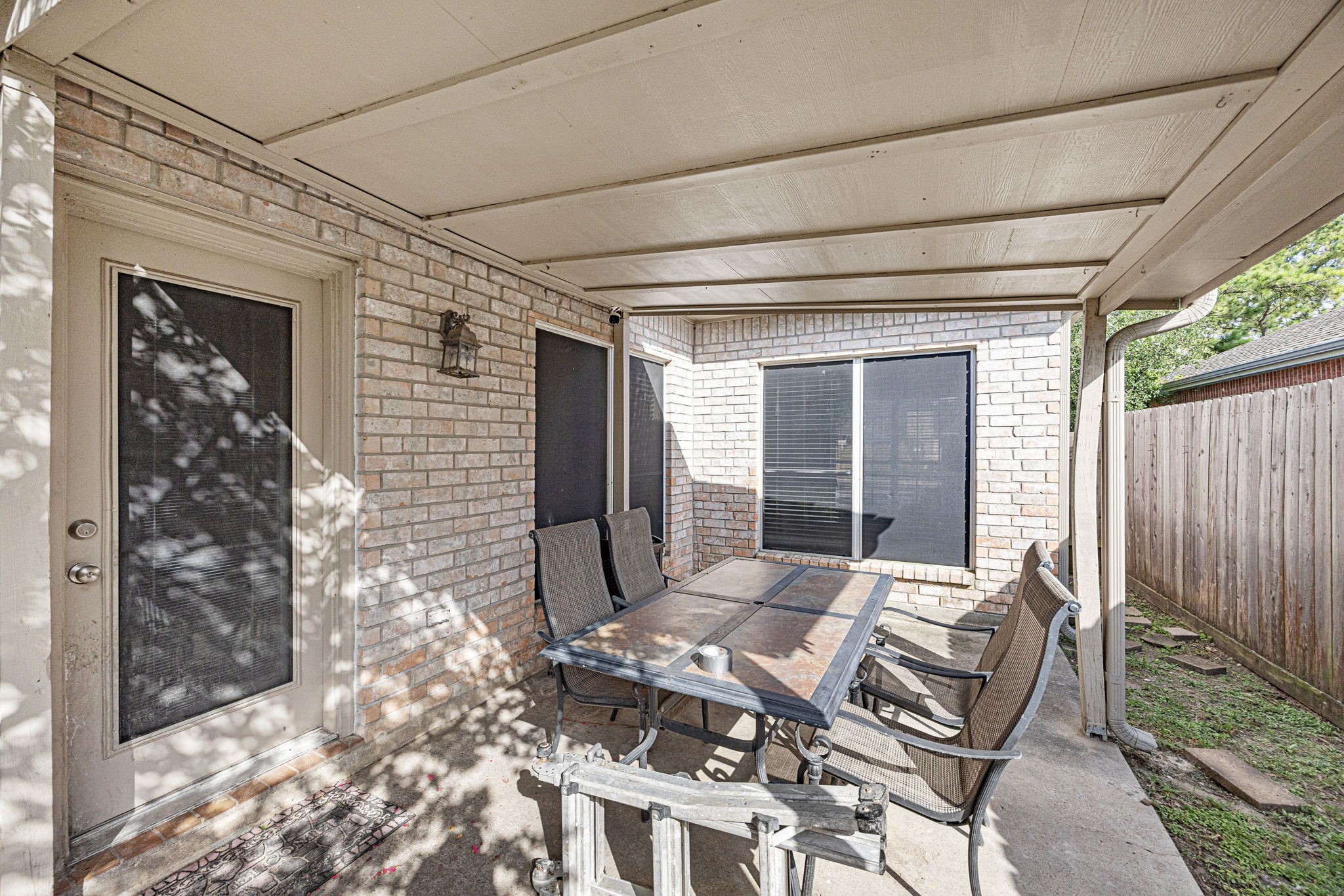 7202 North Fawn River Circle Spring, TX 77379 - Photo 21 of 22 a backyard of a house with outdoor seating