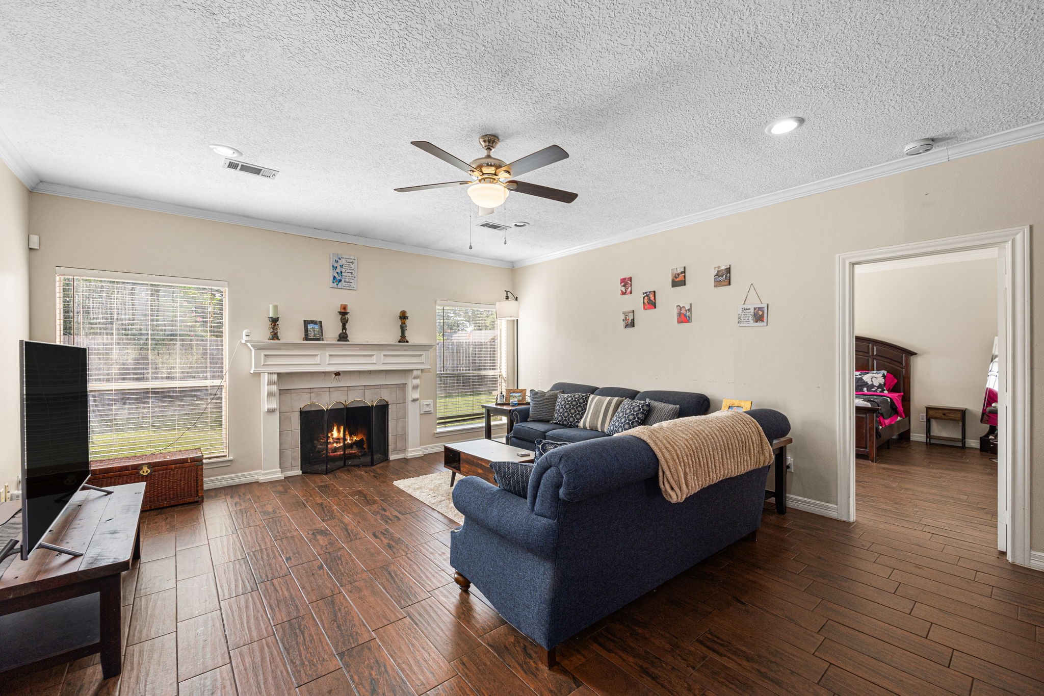 7202 North Fawn River Circle Spring, TX 77379 - Photo 9 of 22 a living room with furniture and a fireplace