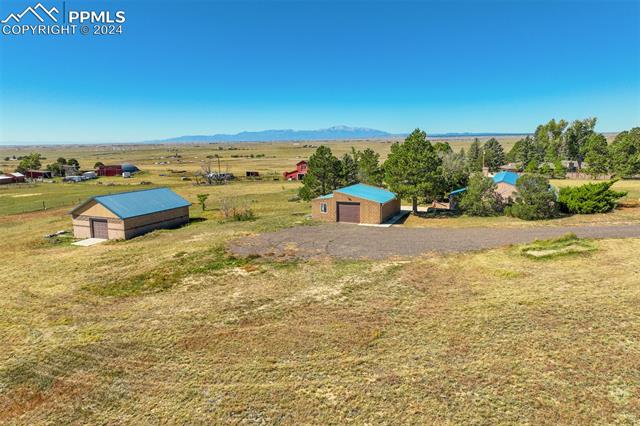 23555 Murphy Road Calhan, CO 80808 - Photo 4 of 49 Aerial view featuring a mountain view and a rural view