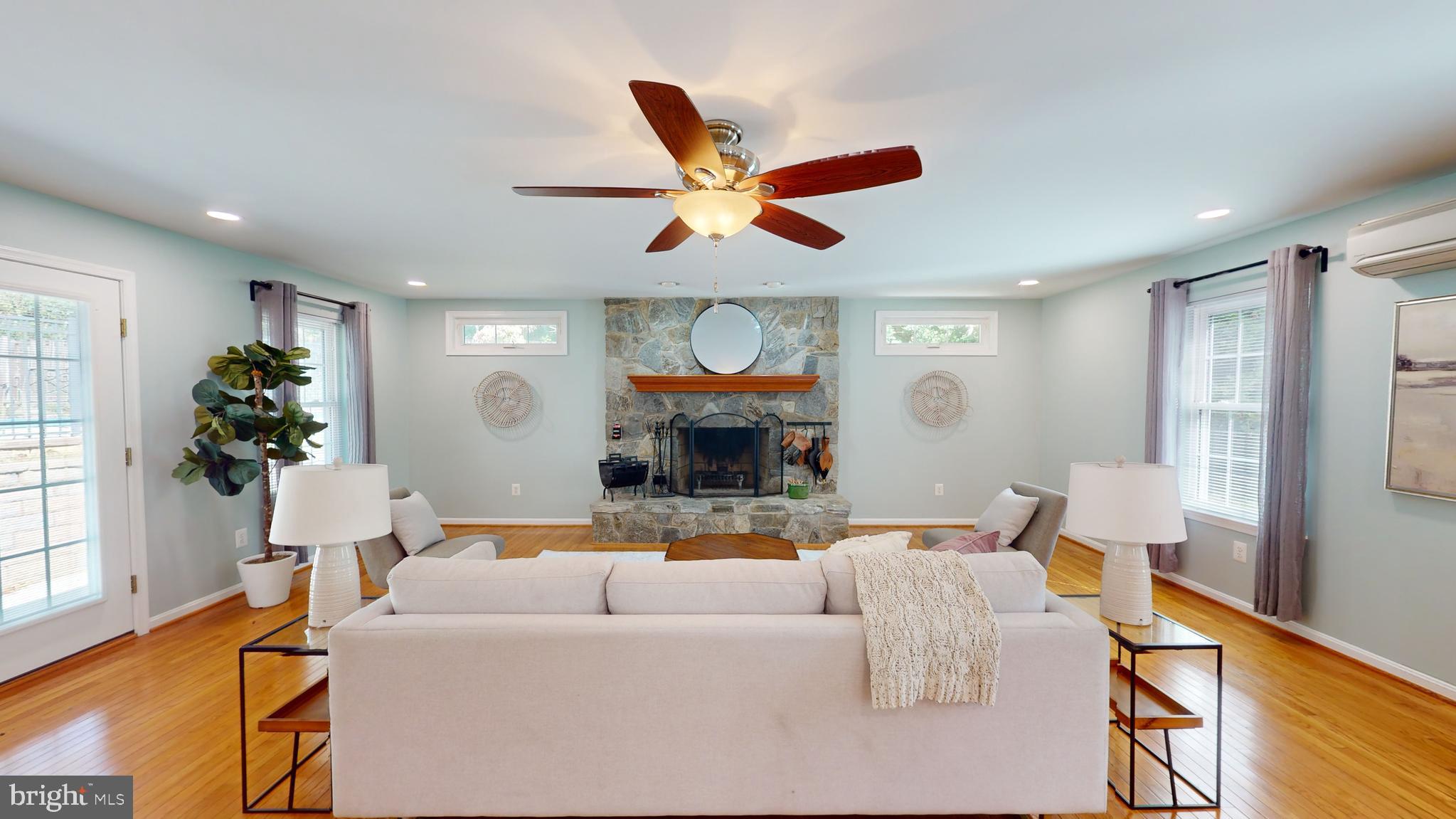 10600 Ward Road Dunkirk, MD 20754 - Photo 36 of 144 a living room with fireplace furniture and a large window