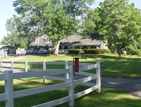 a view of a chairs and table in the yard