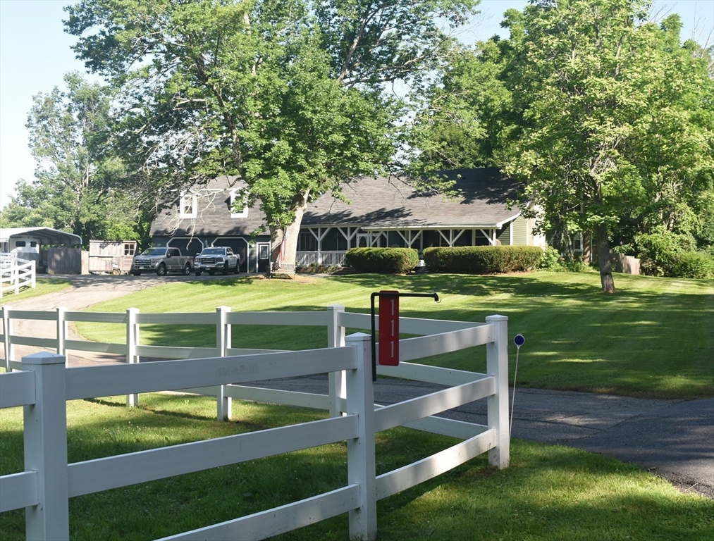 a view of a chairs and table in the yard