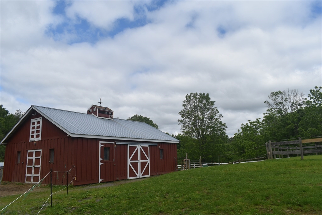 111 Northwest Road Spencer, MA 01562 - Photo 2 of 34 a front view of a house with garden