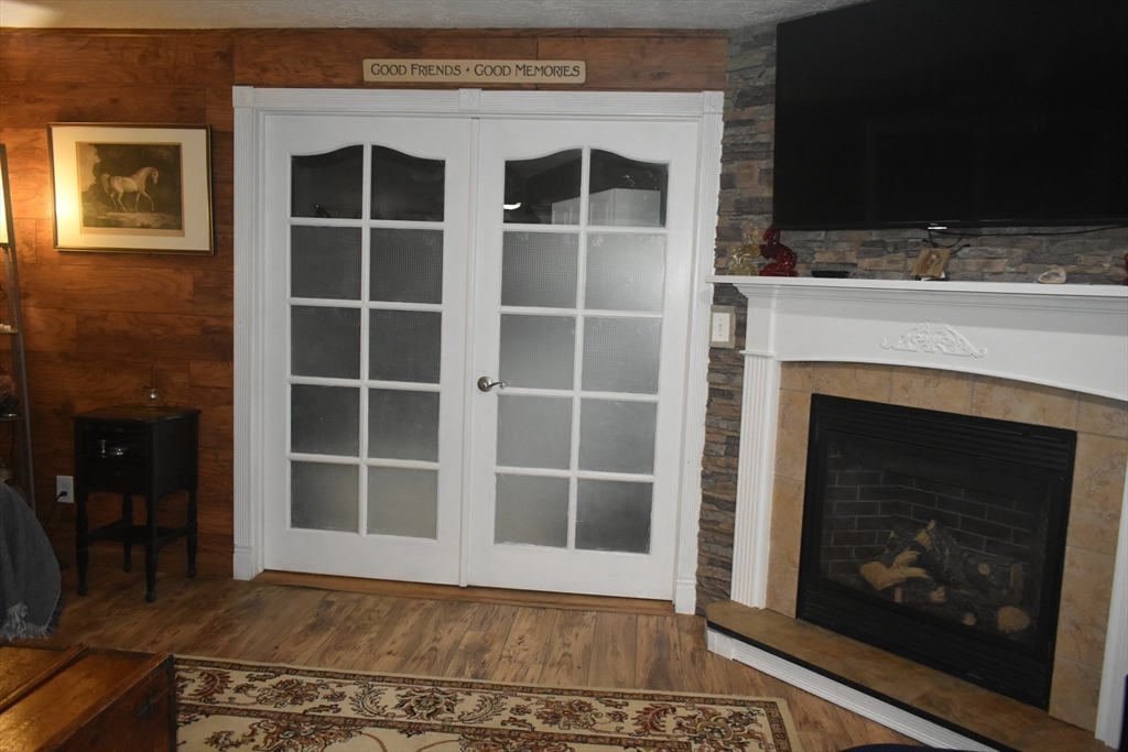 111 Northwest Road Spencer, MA 01562 - Photo 9 of 34 a view of an empty room with a fireplace and a window