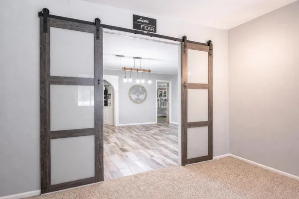 a kitchen with a sink cabinets and a window