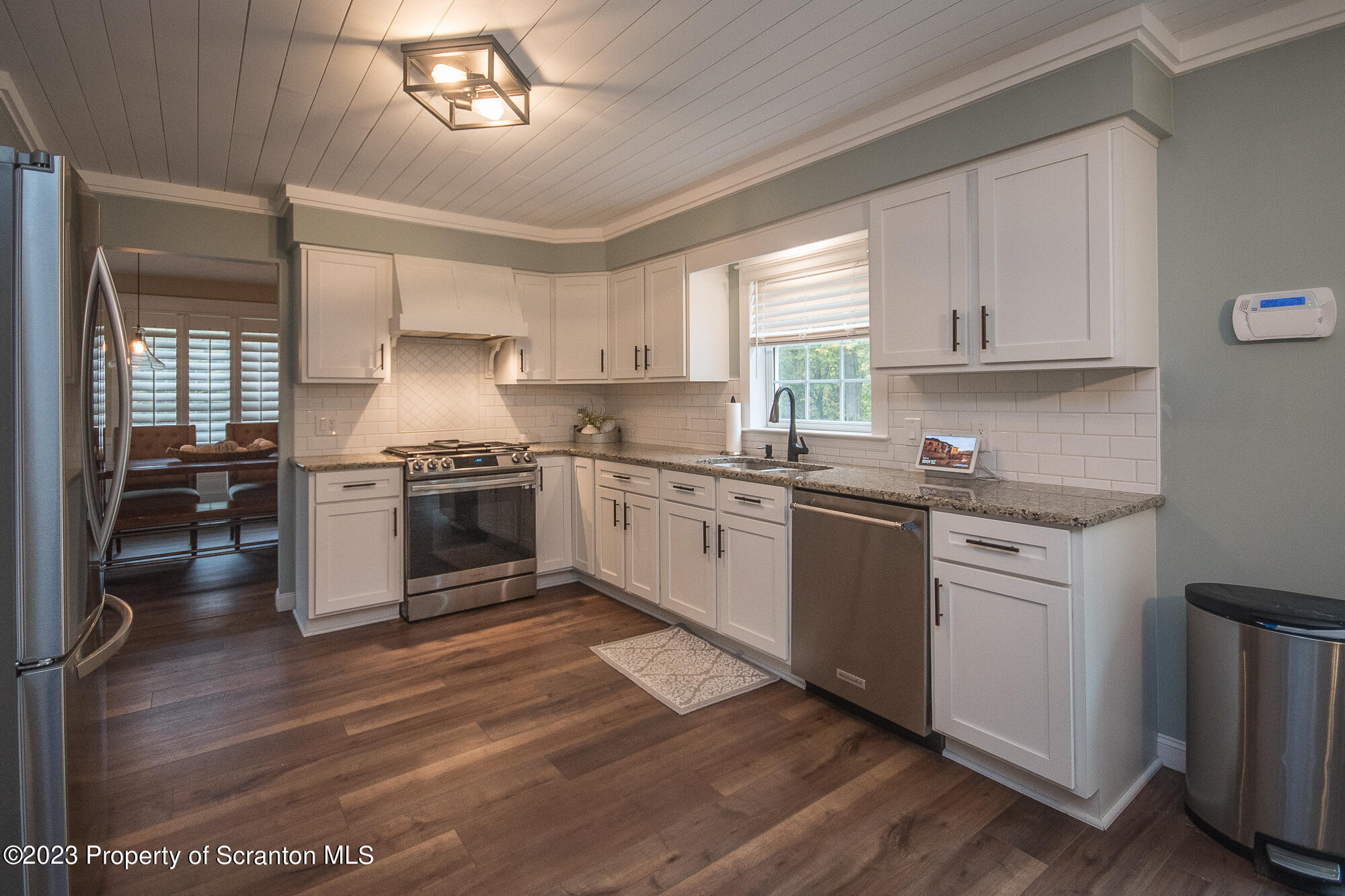 34 Blackberry Hill Road Moscow, PA 18444 - Photo 15 of 43 a kitchen with granite countertop a stove top oven sink and cabinets