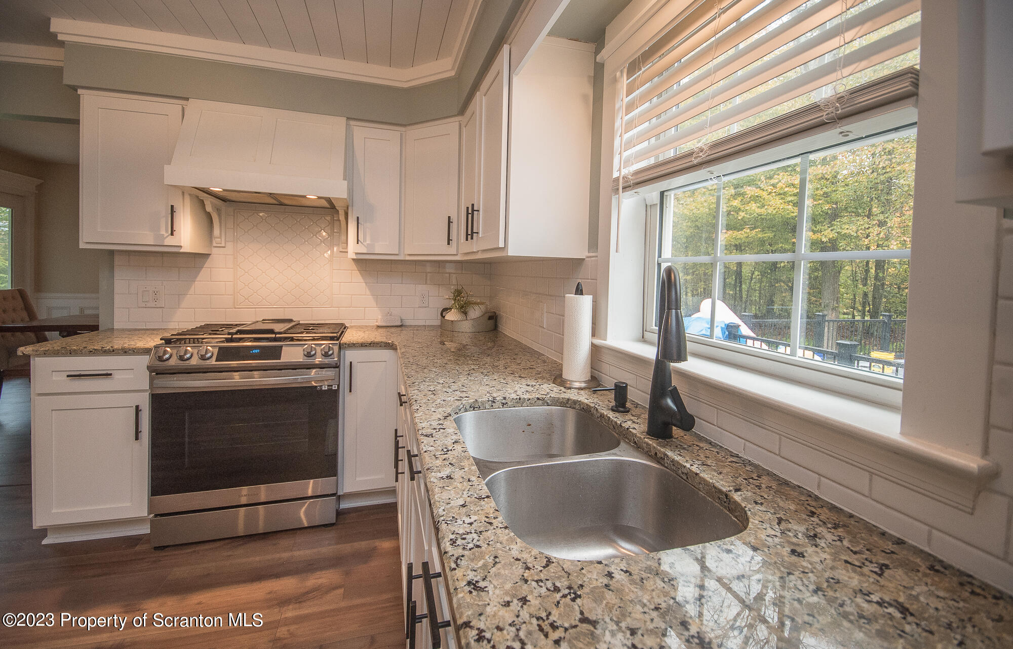 34 Blackberry Hill Road Moscow, PA 18444 - Photo 18 of 43 a kitchen with granite countertop a sink stainless steel appliances and cabinets