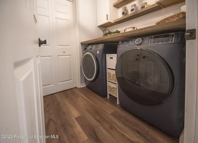 a utility room with dryer and washer