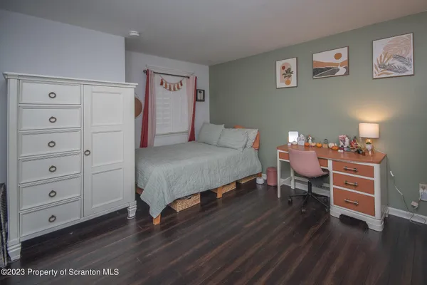 a bedroom with a bed and a table in it