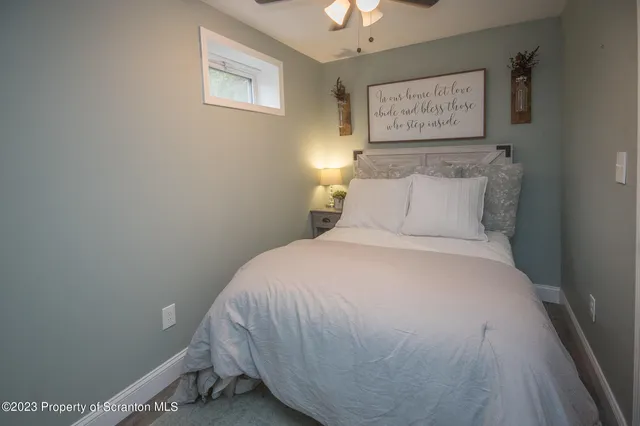 a bedroom with a bed and a table