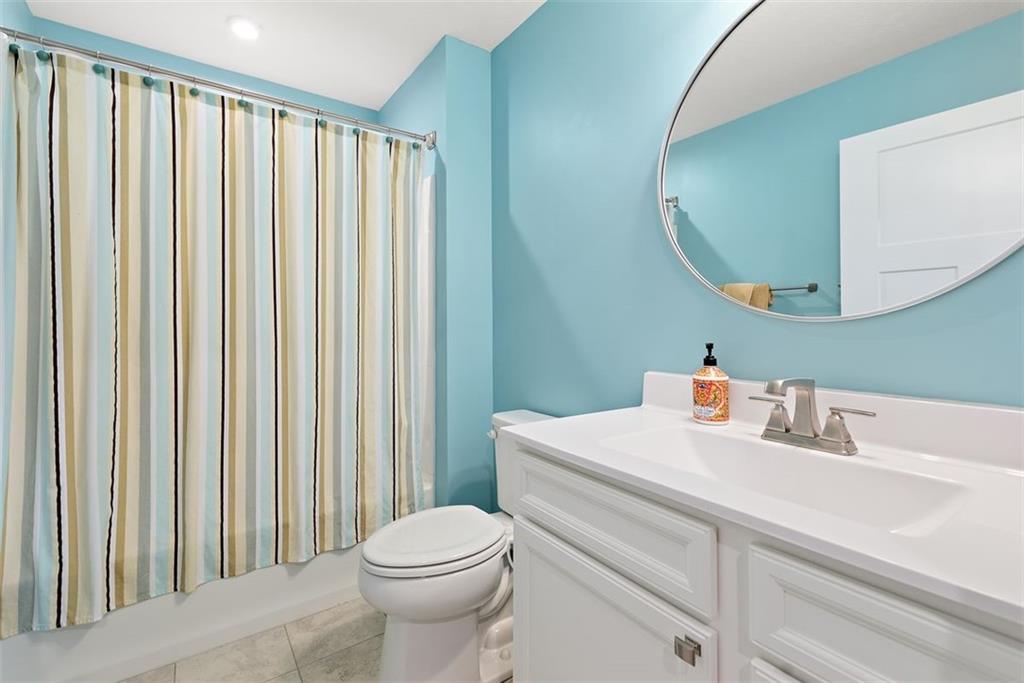 508 Hogan Drive Monroeville, PA 15146 - Photo 12 of 26 a bathroom with a sink a toilet and mirror