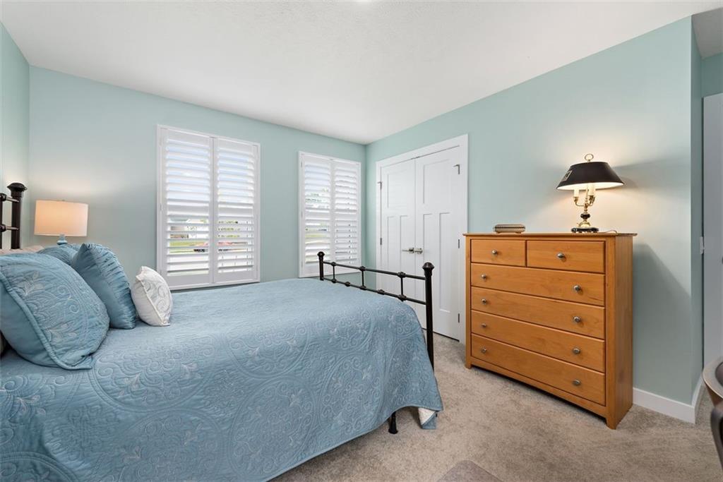 508 Hogan Drive Monroeville, PA 15146 - Photo 16 of 26 a spacious bedroom with a bed and a lamp