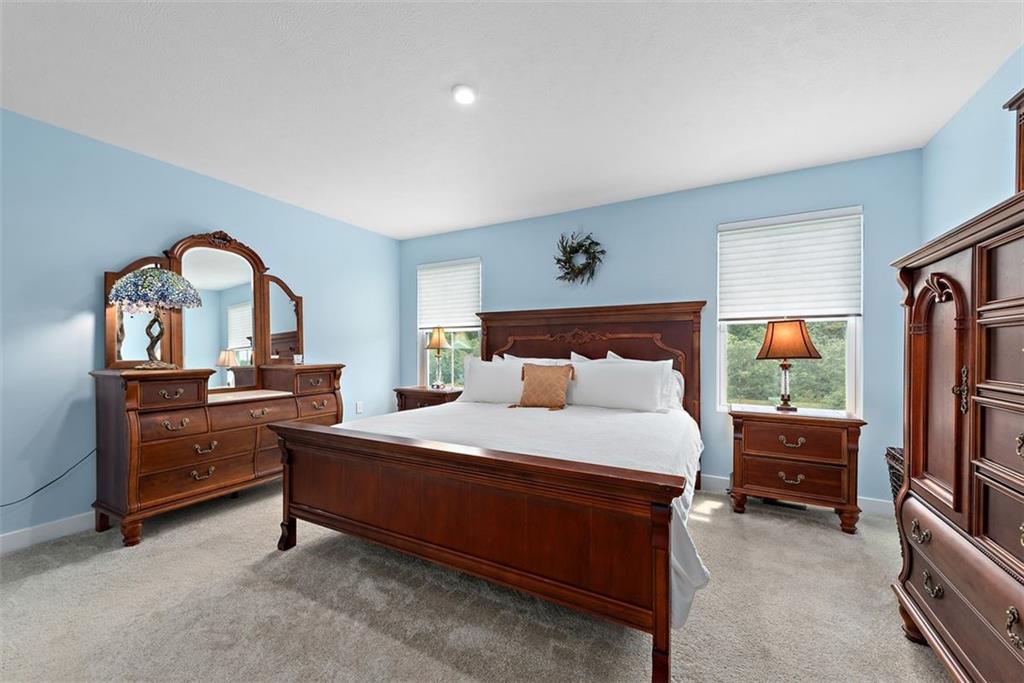 508 Hogan Drive Monroeville, PA 15146 - Photo 17 of 26 a bedroom with a bed and a dresser