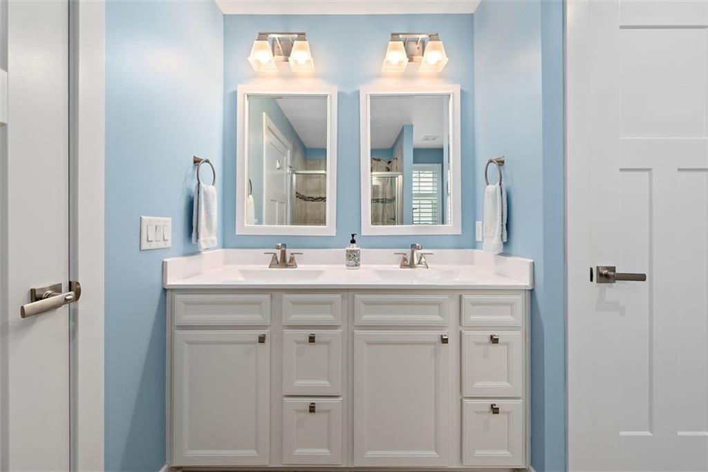 508 Hogan Drive Monroeville, PA 15146 - Photo 22 of 26 a bathroom with a granite countertop sink and a mirror