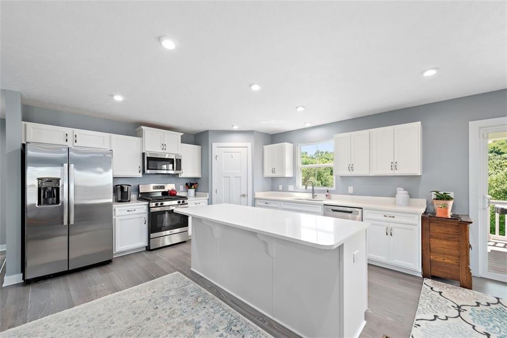 508 Hogan Drive Monroeville, PA 15146 - Photo 7 of 26 a kitchen with cabinets and stainless steel appliances