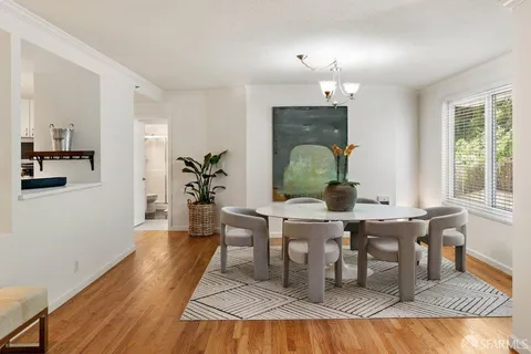 a view of a livingroom with furniture window and wooden floor