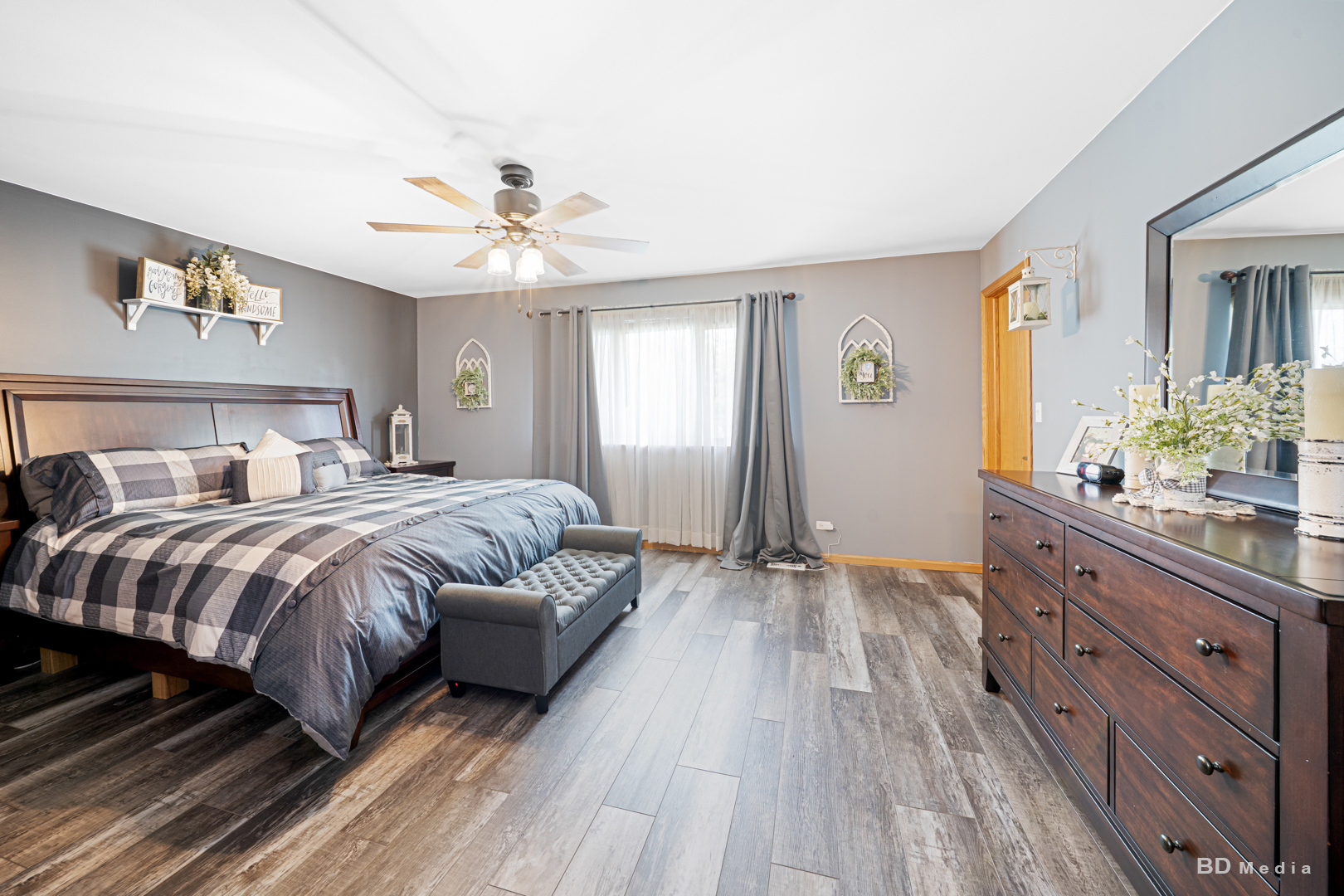 2018 Olde Mill Road Plainfield, IL 60586 - Photo 13 of 30 a spacious bedroom with a bed and a chandelier