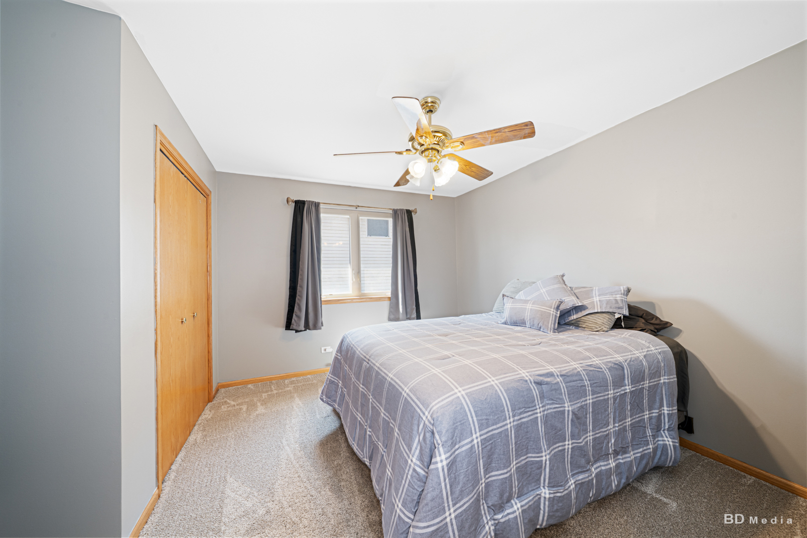 2018 Olde Mill Road Plainfield, IL 60586 - Photo 16 of 30 a bedroom with a bed and a chandelier