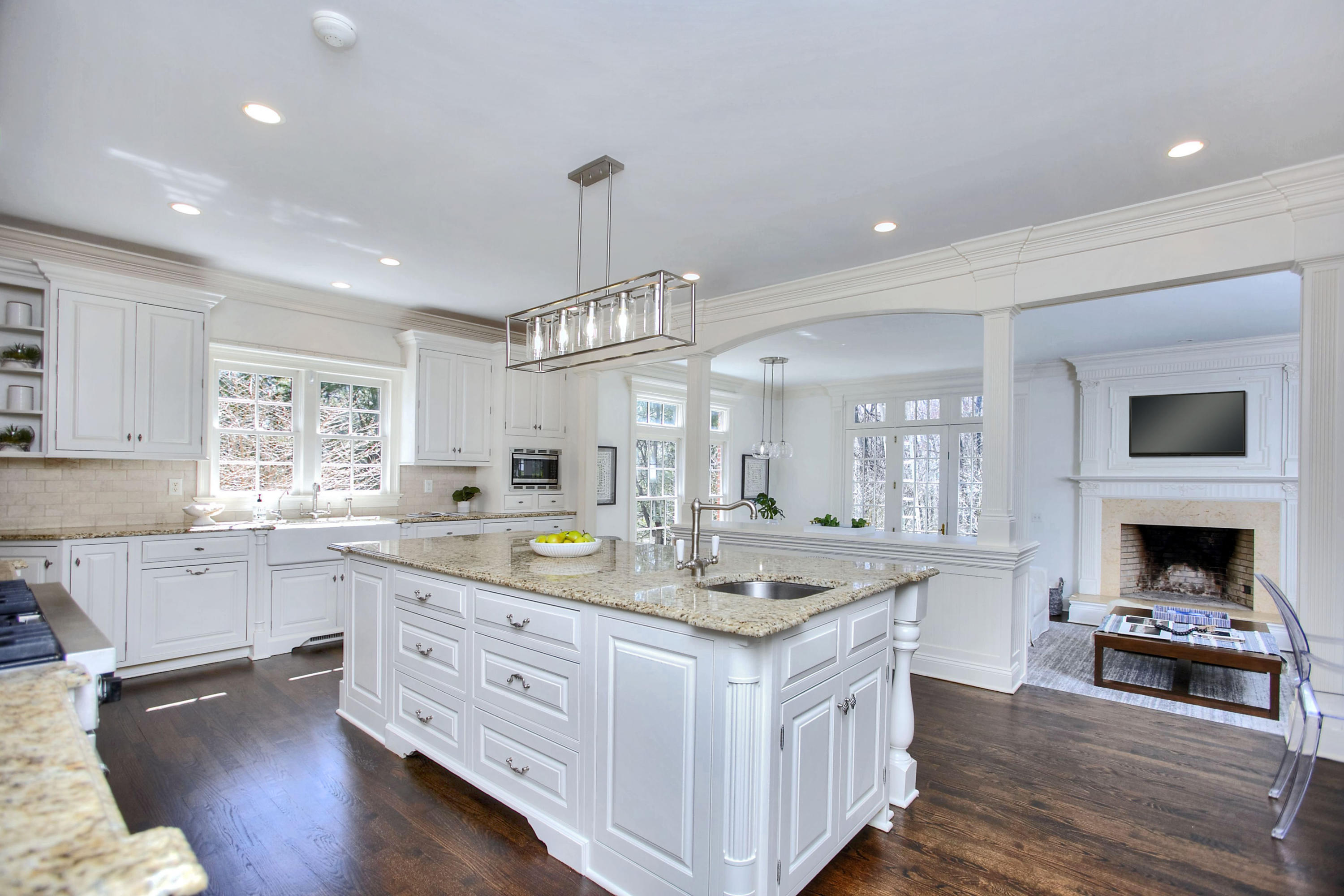 320 Ponus Ridge Road New Canaan, CT 06840 - Photo 13 of 40 a kitchen with a stove window and cabinets